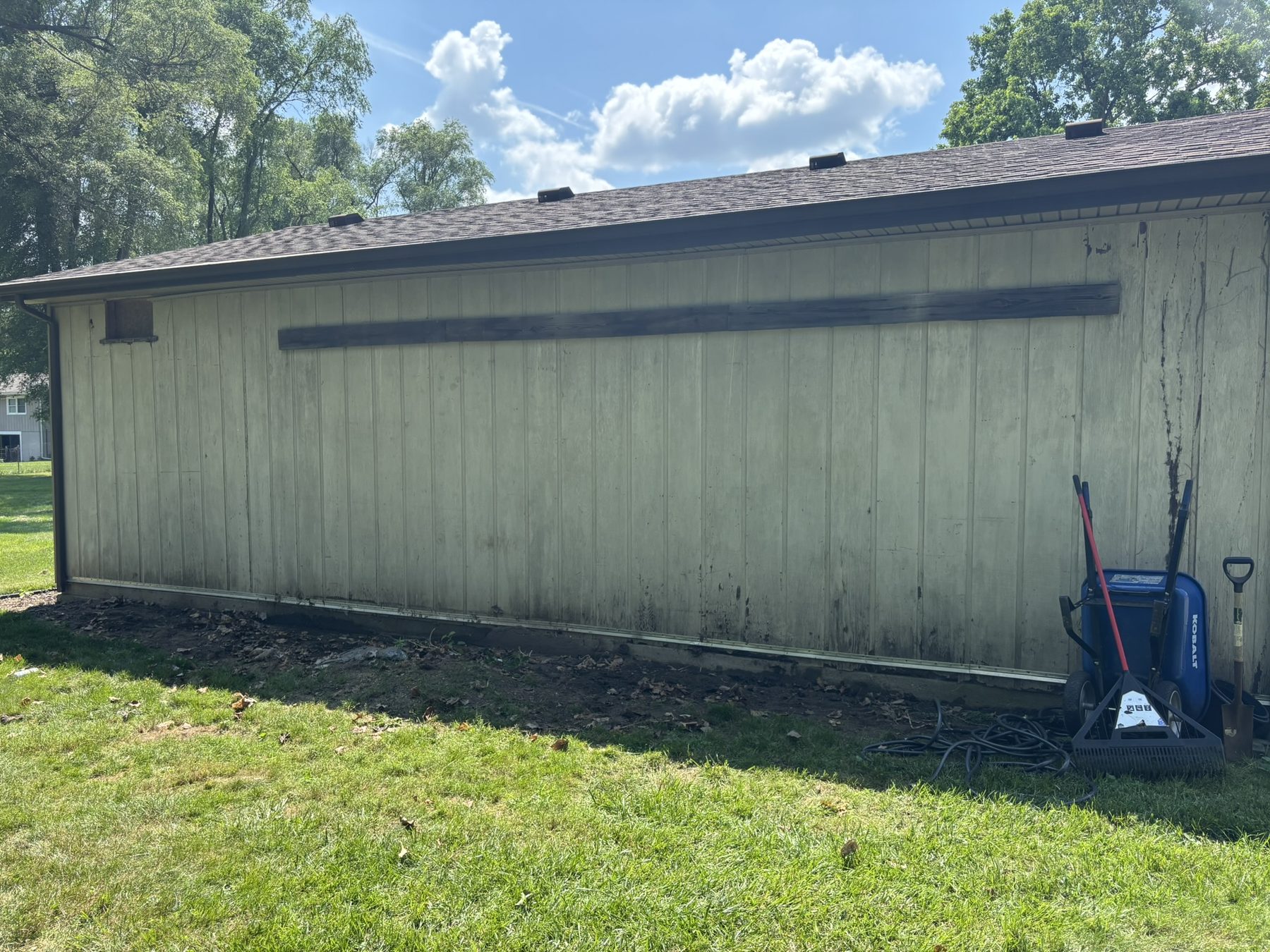 After junk removal with the garage wall area cleared